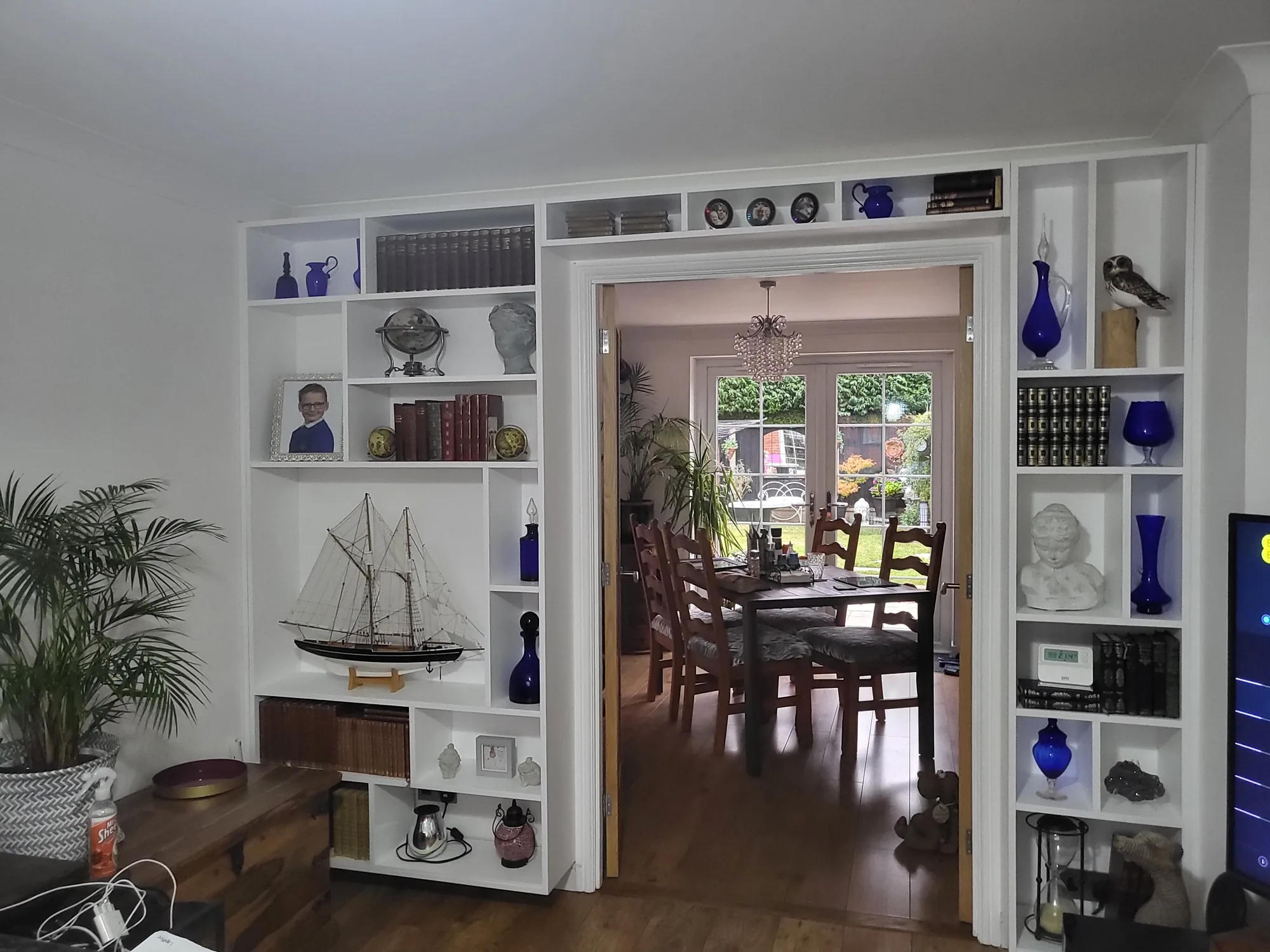 Custom bookcase and display shelving built into a period property