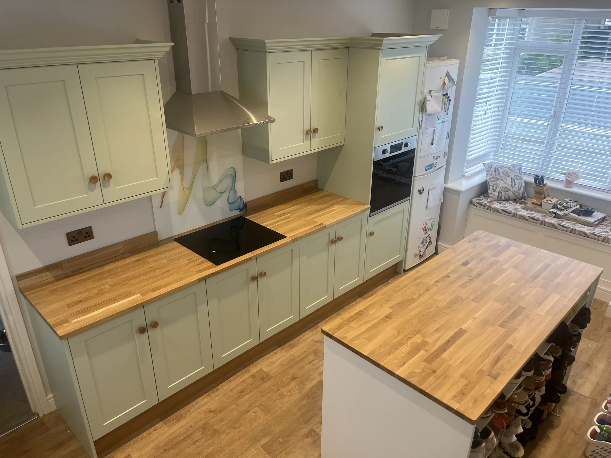 Handmade kitchen with cream shaker doors and dark stone worktop